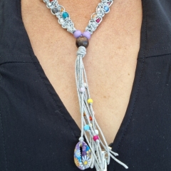 Grey macrame necklace with beads in various colours