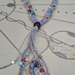 Grey macrame necklace with beads in various colours