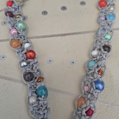 Grey macrame necklace with beads in various colours